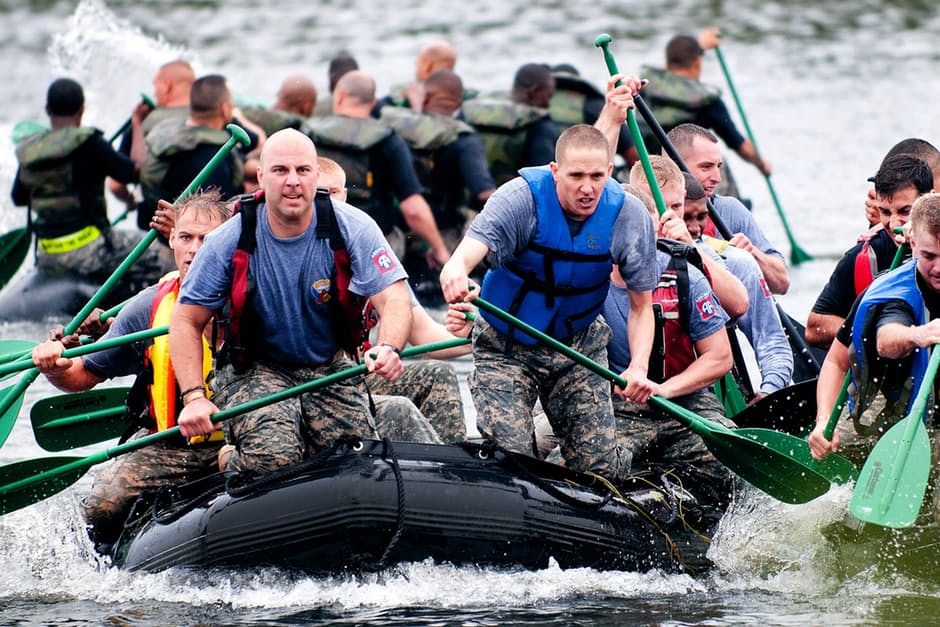 Men paddling riding on the boat