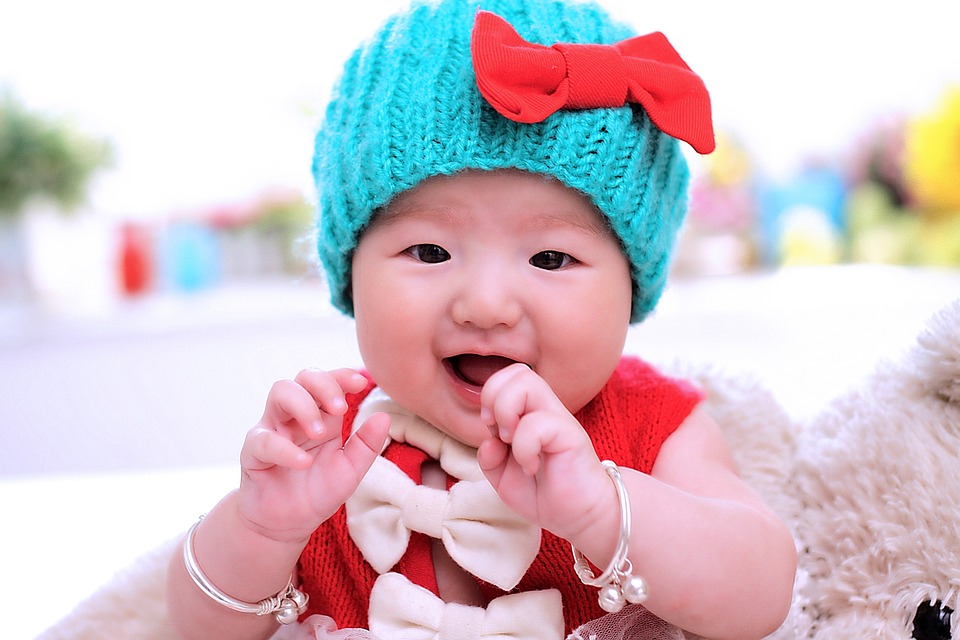 Cute baby girl wearing blue bonnet