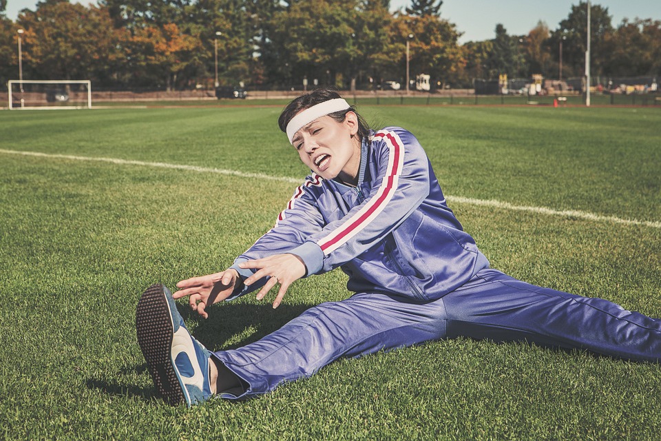 Woman stretching reaching his right foot